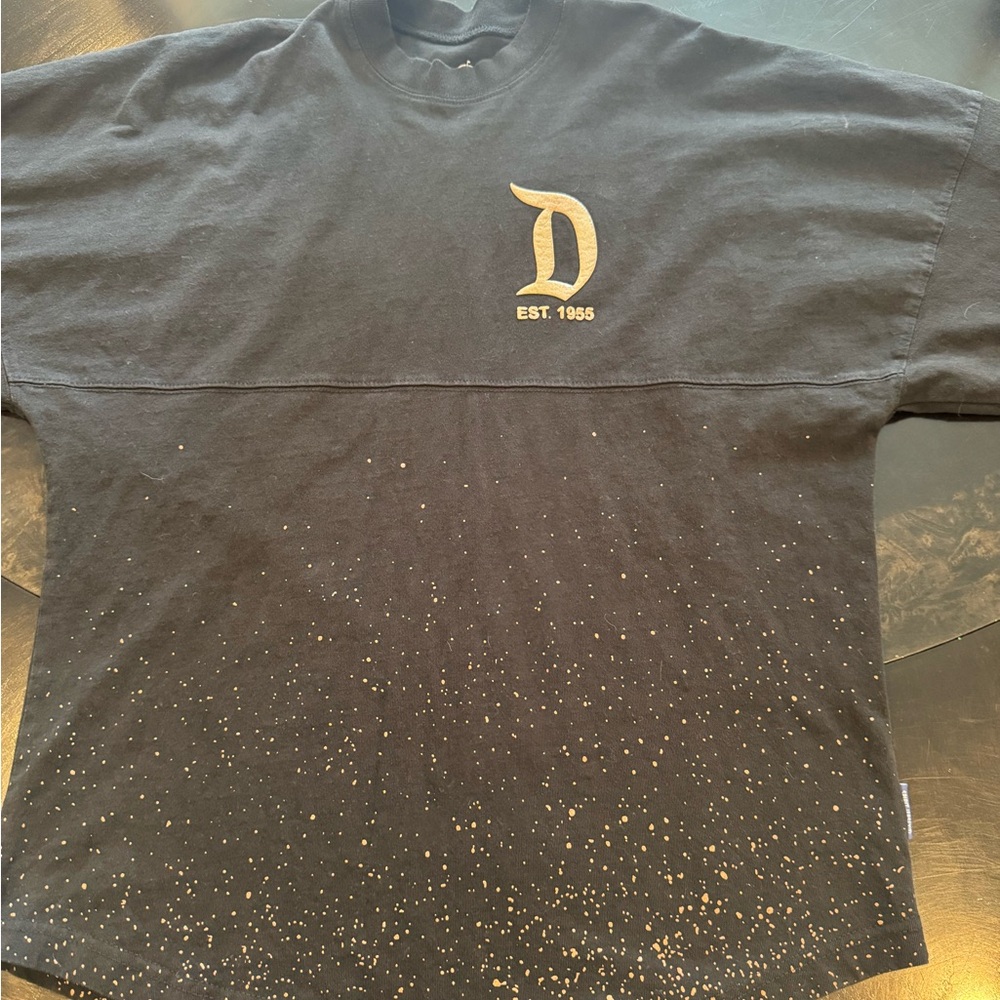 Disney Spirit Jersey  Black Tee with Gold 'D' and Speckle Print